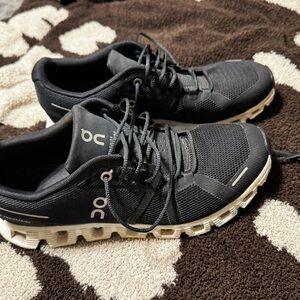 On Running Black and White Athletic Shoes with CloudTec